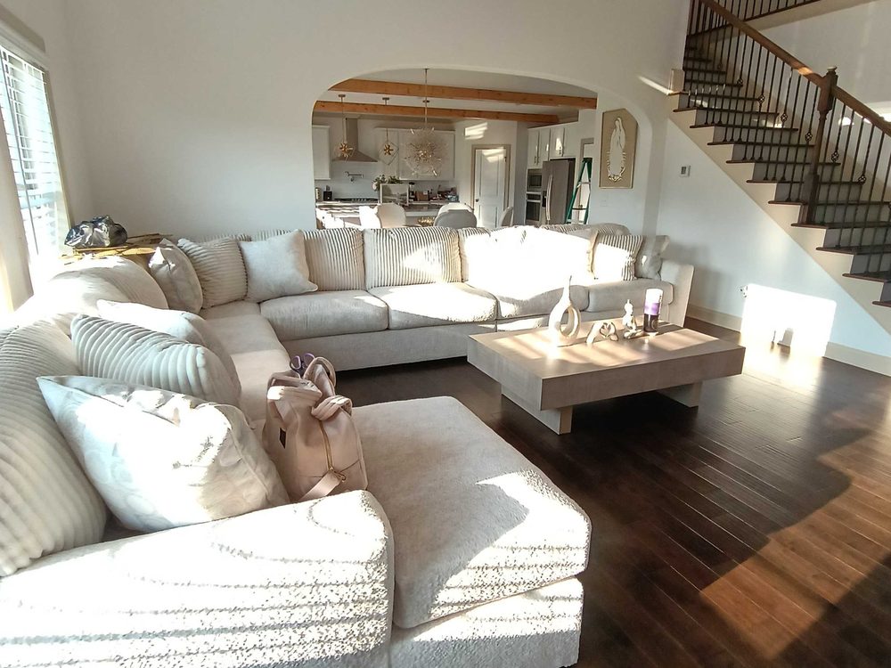 Two-storey living room finished after a Red Sky clean